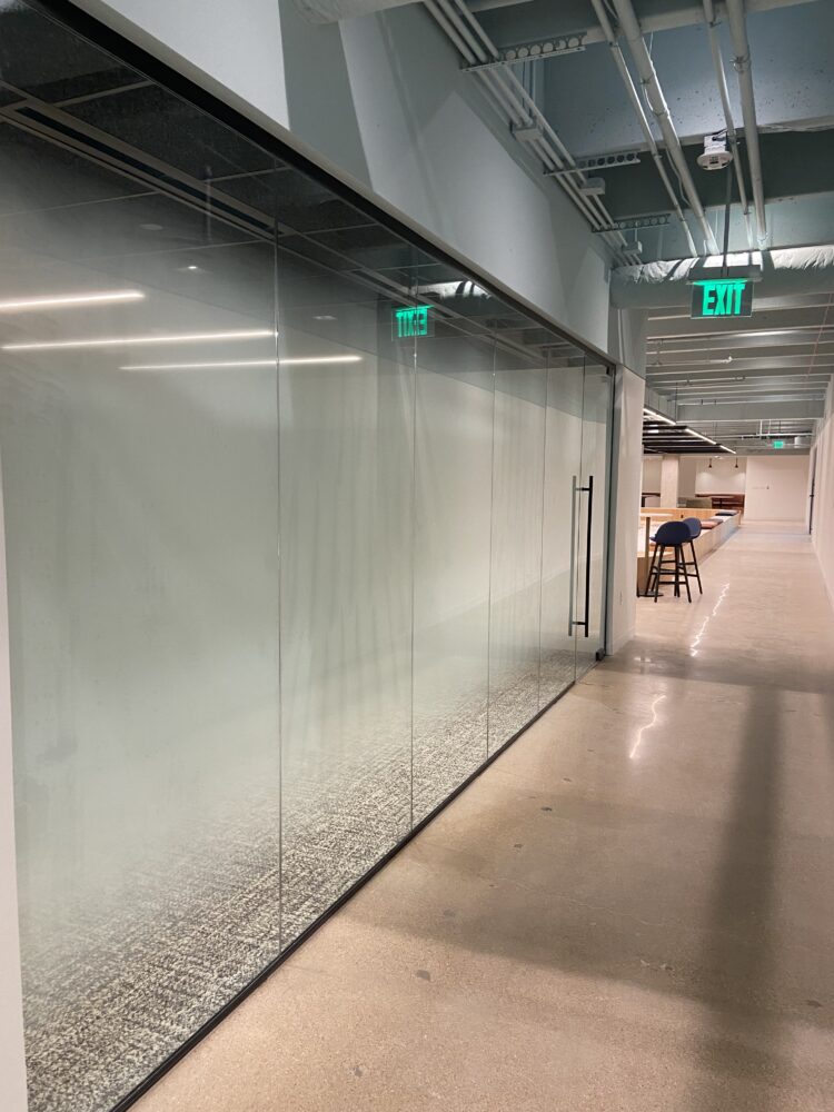 The Gild in Dallas Under Renovation Installing Centered Custom Frost Fade Window Film to Existing Glass in Offices and Conference Rooms